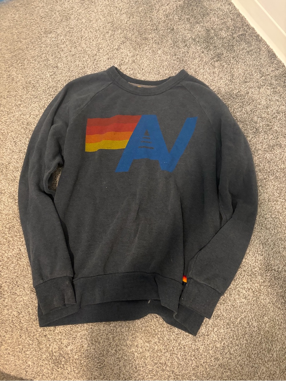 Aviator Nation Charcoal Sweatshirt with Red-Orange-Yellow Stripe & Blue AV Logo